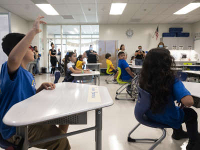 A student participates in the first day of school at Sunkist Elementary School in Anaheim, California, on August 11, 2022.