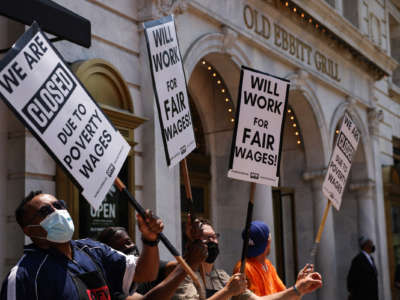 Activists with One Fair Wage participate in a “Wage Strike" demonstration outside of the Old Ebbitt Grill restaurant on May 26th, 2021 in Washington, D.C.