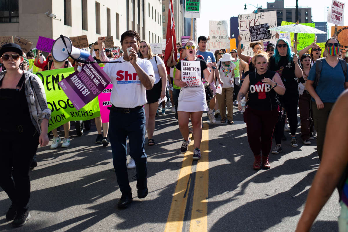 Abortion rights demonstrators march through the streets to protest the Supreme Court's decision in the Dobbs v. Jackson Women's Health Organization case on June 24, 2022, in Detroit, Michigan.
