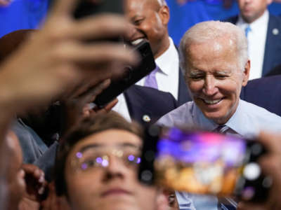 President Joe Biden greets supporters after speaking at a rally hosted by the Democratic National Committee at Richard Montgomery High School on August 25, 2022, in Rockville, Maryland.