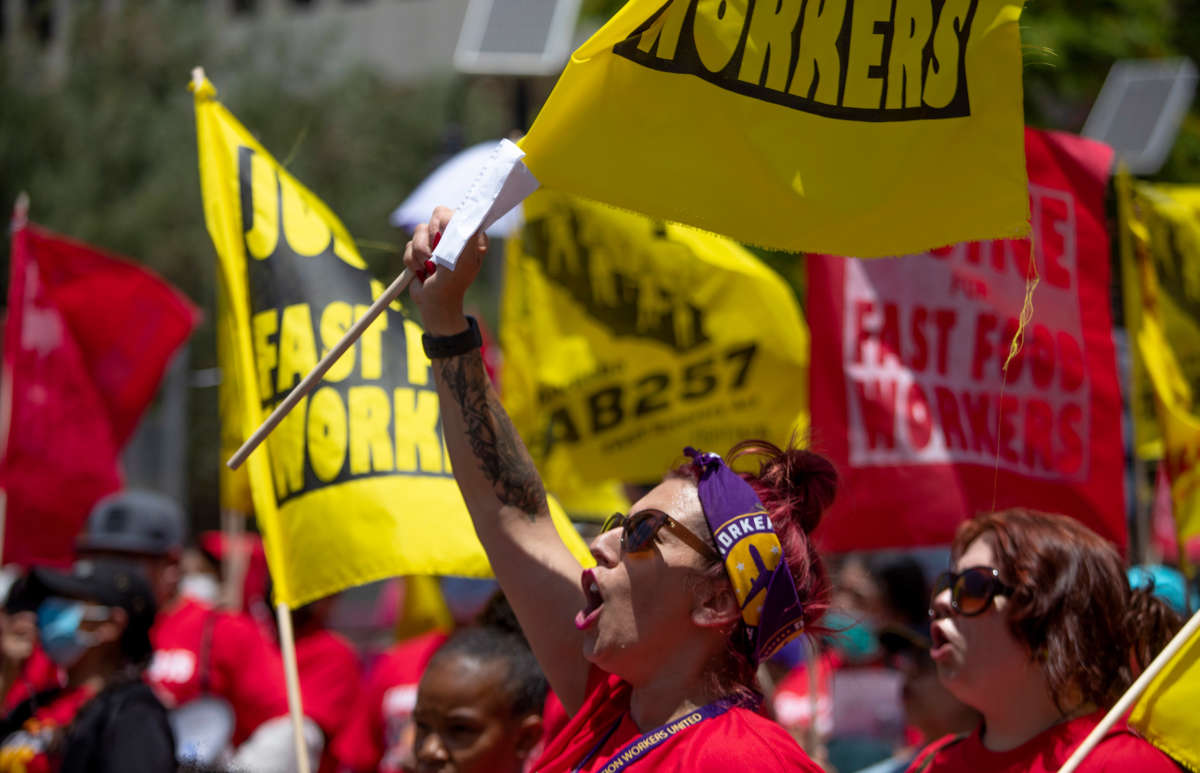 Fast food workers rally at Los Angeles City Hall to protest unsafe working conditions and to demand a voice on the job through AB 257, on June 8, 2022, in Los Angeles.