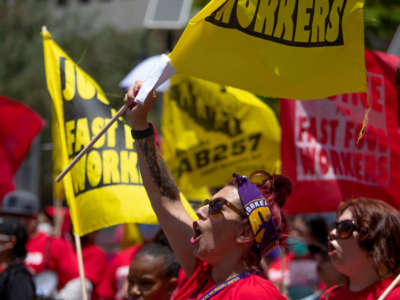 Fast food workers rally at Los Angeles City Hall to protest unsafe working conditions and to demand a voice on the job through AB 257, on June 8, 2022, in Los Angeles.