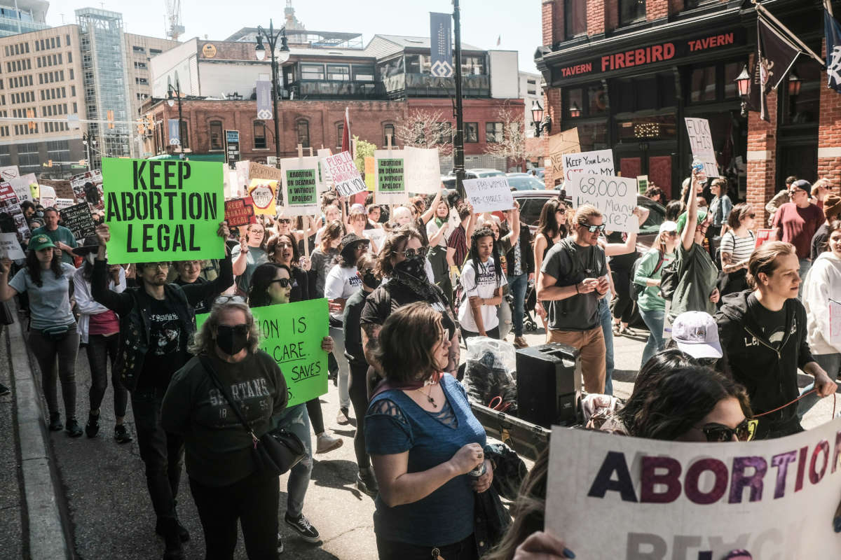 Protesters march through downtown Detroit in support of Roe v Wade on May 7, 2022.