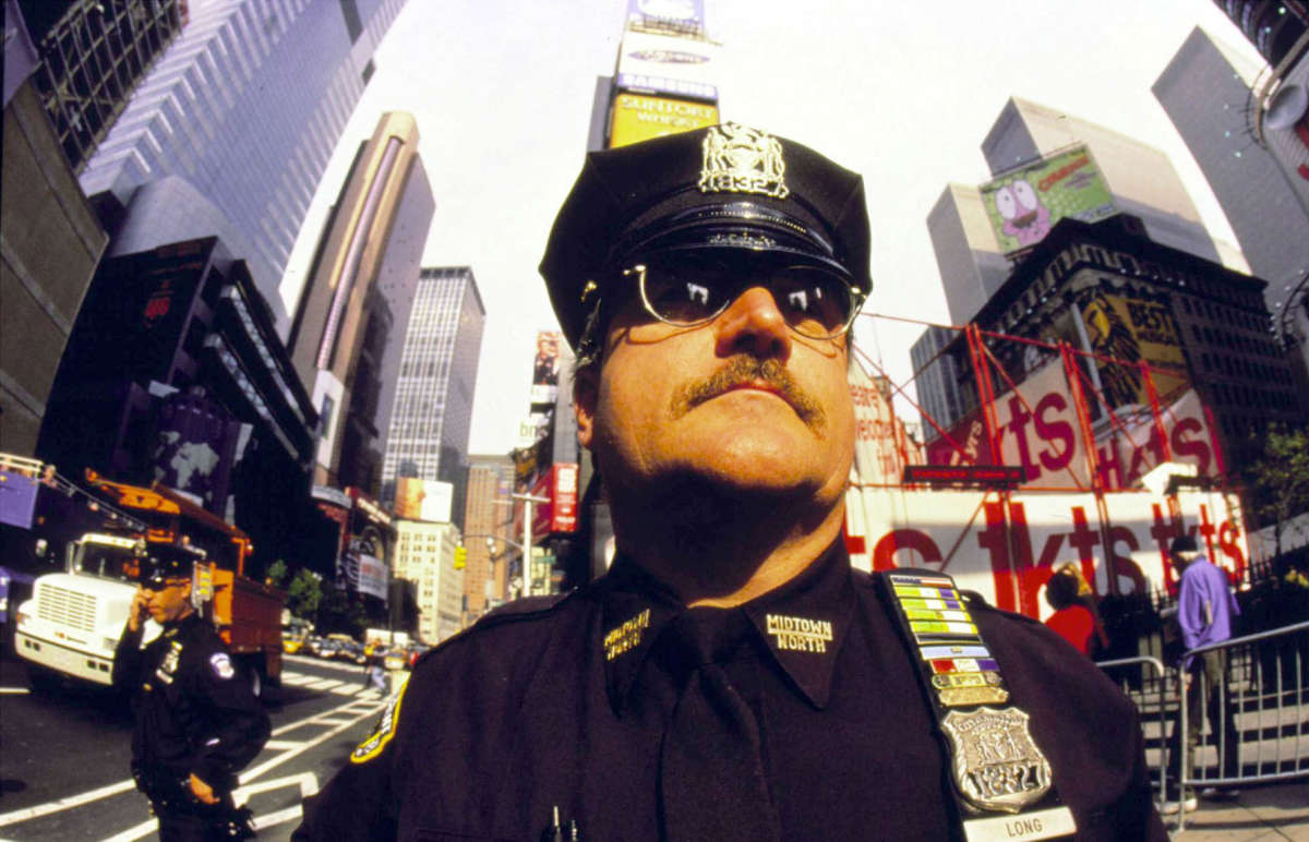 A New York City police officer patrols Times Square in Manhattan in November, 1999.