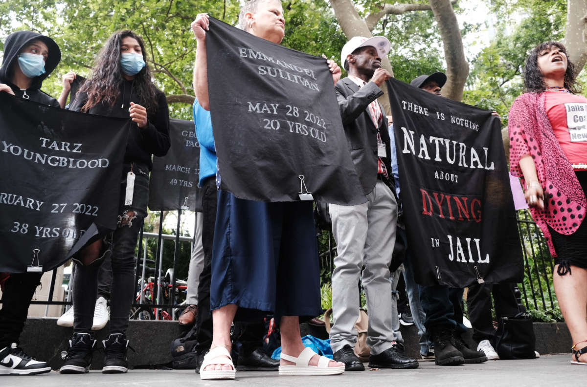 Family members, activists, and others hold a rally outside of city hall to demand that the administration of New York City Mayor Eric Adams do more to address the crisis in living conditions at the Rikers Island Jail on June 23, 2022.