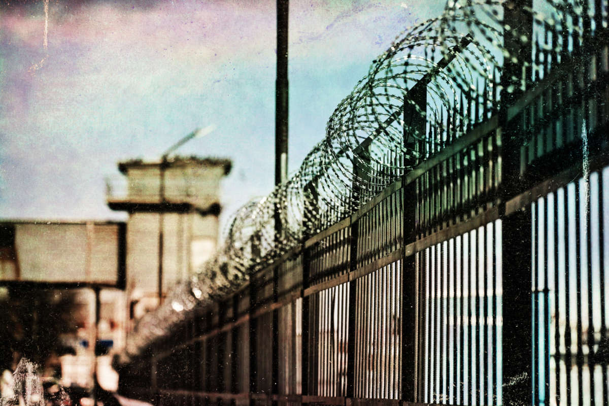 Prison fence with toxic sky