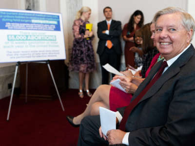 Sen. Lindsey Graham smiles before speaking during his news conference on Capitol Hill to announce a national bill on abortion restrictions on September 13, 2022.