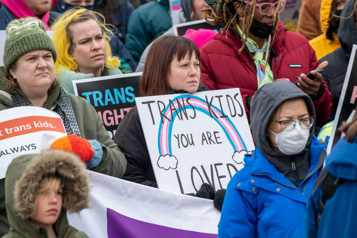 People hold a rally to support trans kids in St. Paul, Minnosota, on March 6, 2022.