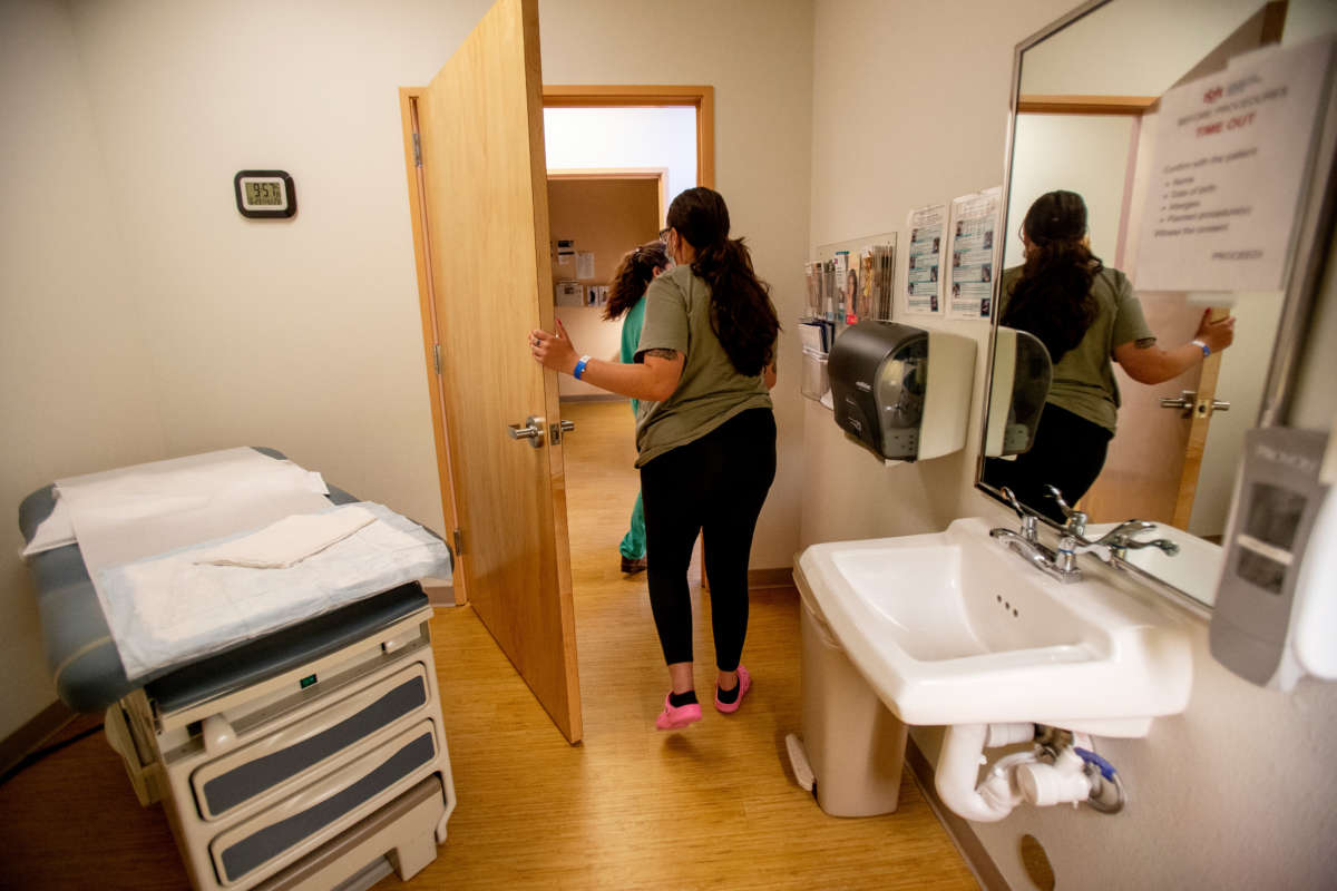 A 25-year-old woman leaves the exam room after receiving medication to terminate her pregnancy the day before the Supreme Court overturned Roe v. Wade at the Center for Reproductive Health clinic on June 23, 2022, in Albuquerque, New Mexico.