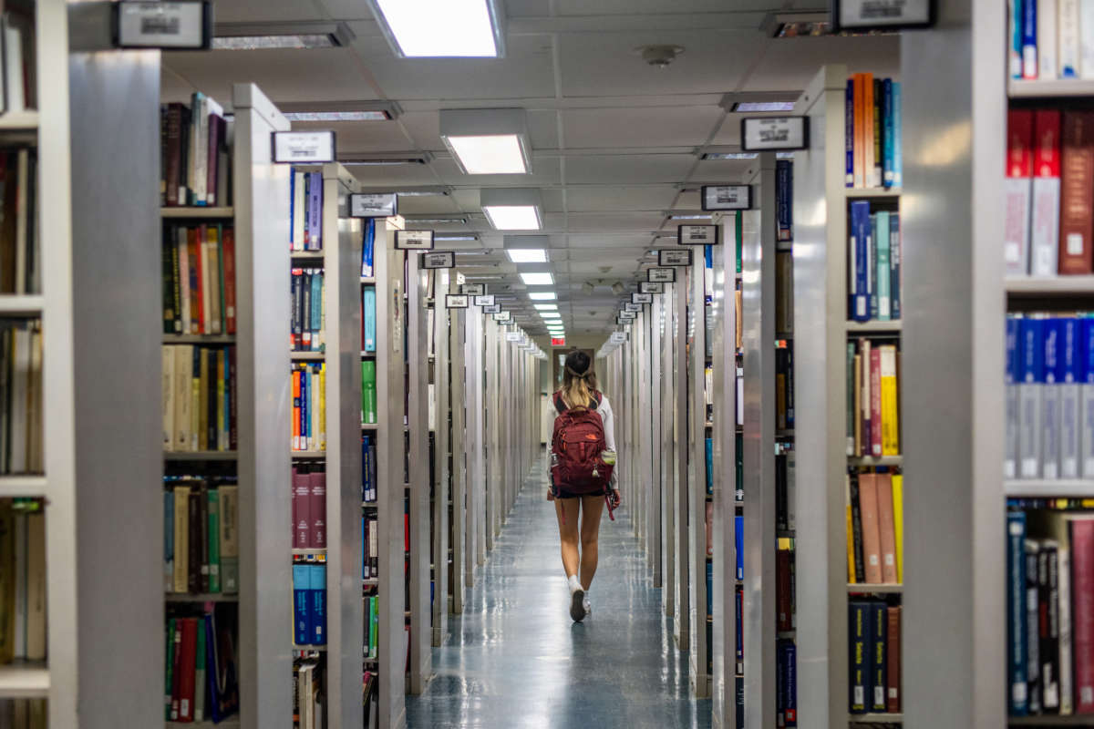 A person walks through the Rice University Library on April 26, 2022, in Houston, Texas.