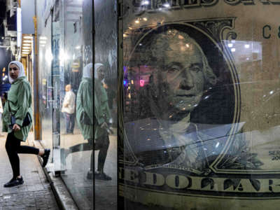 A hijabi exists a store with a large sign of a $1 bill prominently displayed in the window