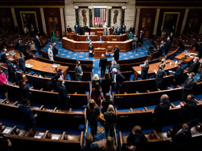 Electoral college votes are brought in prior to the resumption of a joint session of Congress on January 6, 2021, in Washington, D.C.