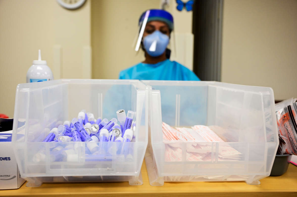 Nurse prepares PCR COVID-19 testing kits