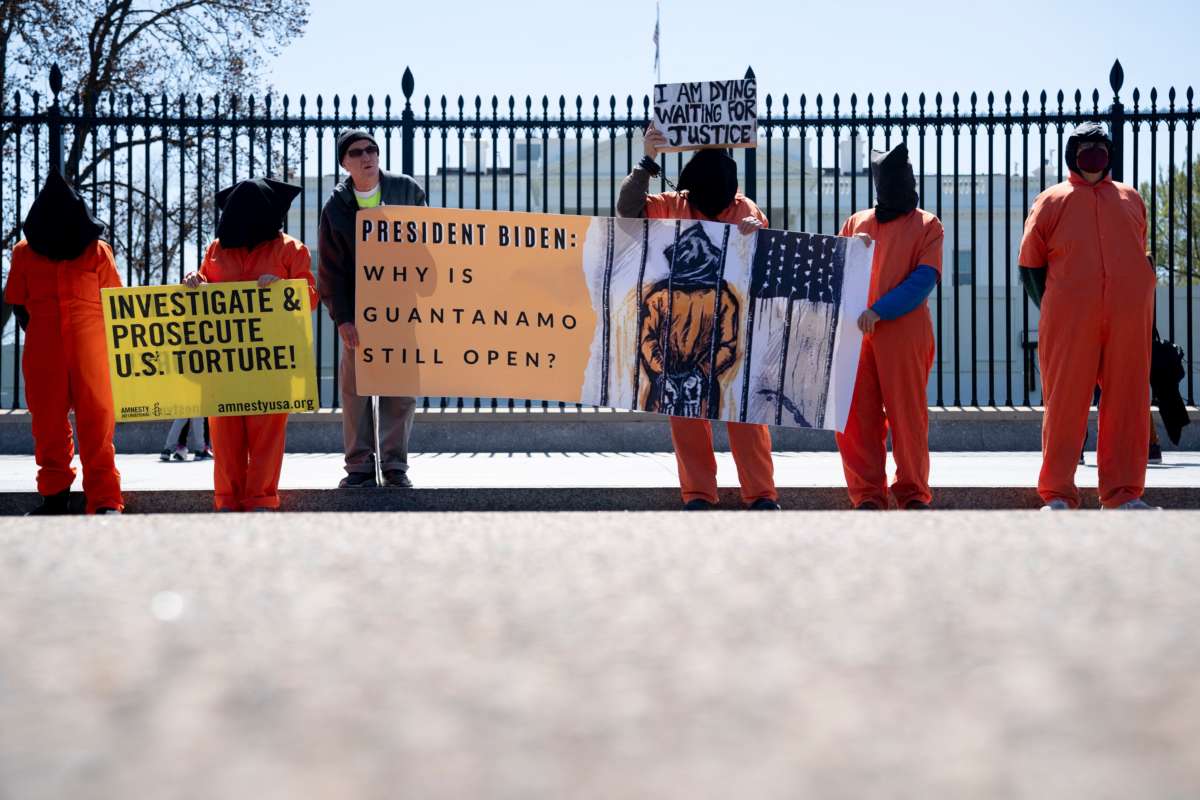 Demonstrators calling for the closure of the Guantánamo Bay detention facility gather in front of the White House in Washington, D.C., on April 2, 2022.