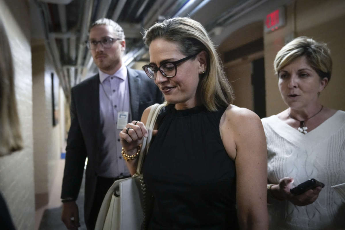 Sen. Kyrsten Sinema walks to a vote at the U.S. Capitol on July 28, 2022 in Washington, D.C.