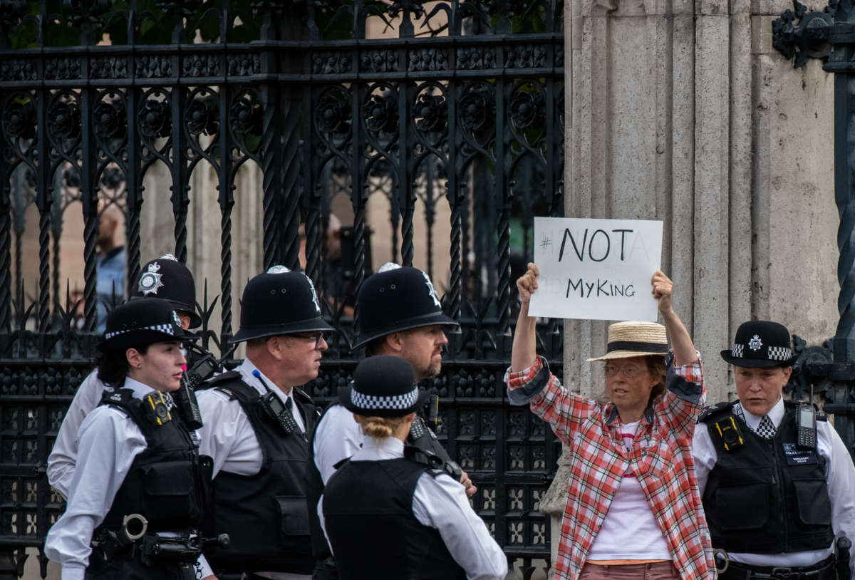 An anti-monarchy protester is surrounded by police outside the Houses of Parliament in London, England, on September 12, 2022.
