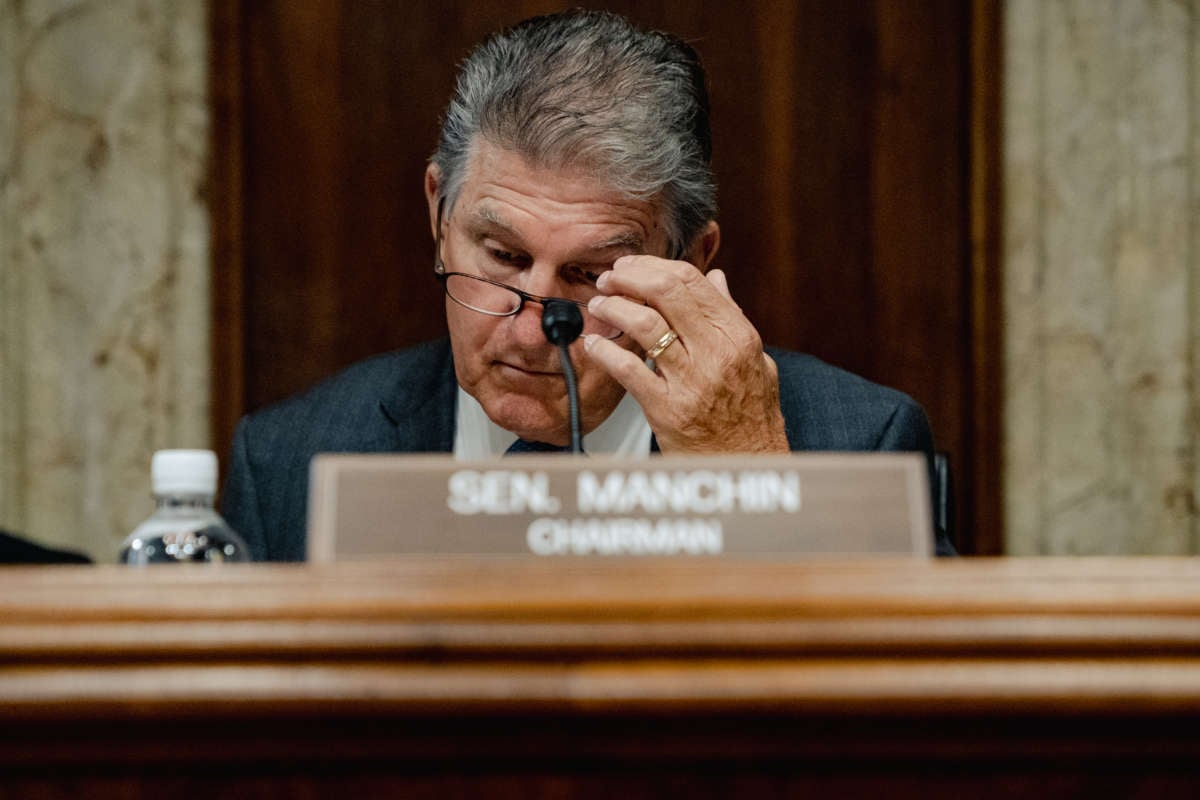 Sen. Joe Manchin, chairman of the Senate Energy and Natural Resources Committee, reads paperwork before holding a hearing on battery technology, at the Dirksen Senate Office Building in Washington, D.C., on September 22, 2022.