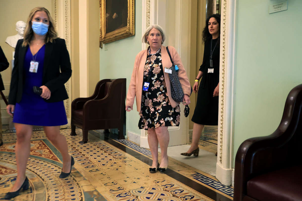 Anita Dunn (center), senior adviser to President Joe Biden, arrives for a lunch meeting with Senate Democrats at the U.S. Capitol on July 22, 2021, in Washington, D.C.