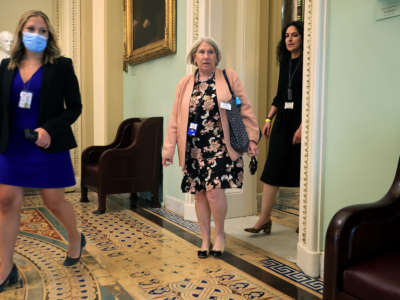 Anita Dunn (center), senior adviser to President Joe Biden, arrives for a lunch meeting with Senate Democrats at the U.S. Capitol on July 22, 2021, in Washington, D.C.