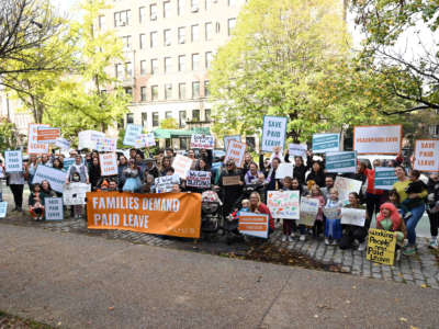 Families attend the NYC For Paid Leave Rally at Grand Army Plaza on October 31, 2021, in Brooklyn, New York.