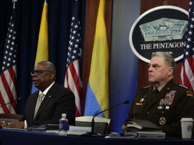 Secretary of Defense Lloyd Austin (left) gives opening remarks as Chairman of the Joint Chiefs of Staff General Mark Milley (right) listens during a virtual meeting of the Ukraine Defense Contact Group at the Pentagon May 23, 2022, in Arlington, Virginia.
