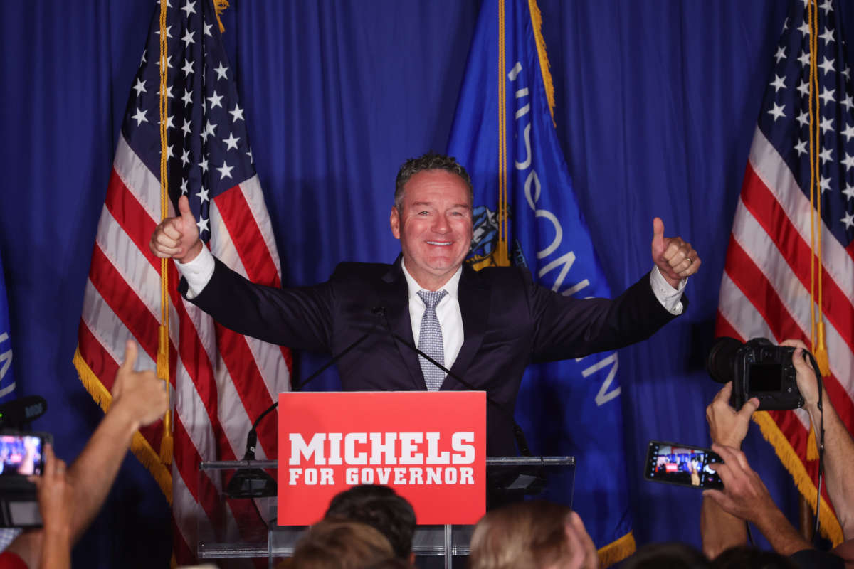Republican gubernatorial candidate Tim Michels greets guests at a rally on August 9, 2022, in Waukesha, Wisconsin. Michels, who was endorsed by former President Donald Trump, won the Republican nomination against former Lt. Gov. Rebecca Kleefisch, who was endorsed by former Vice President Mike Pence.