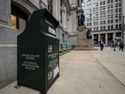 A mail ballot drop box is displayed outside Philadelphia city hall on October 24, 2022. Philadelphia's 18 secure mail ballot drop boxes, positioned around the city, are monitored by security cameras and equipped with fire extinguishing systems to protect against tampering.