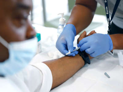 A man recieves a monkeypox vaccine