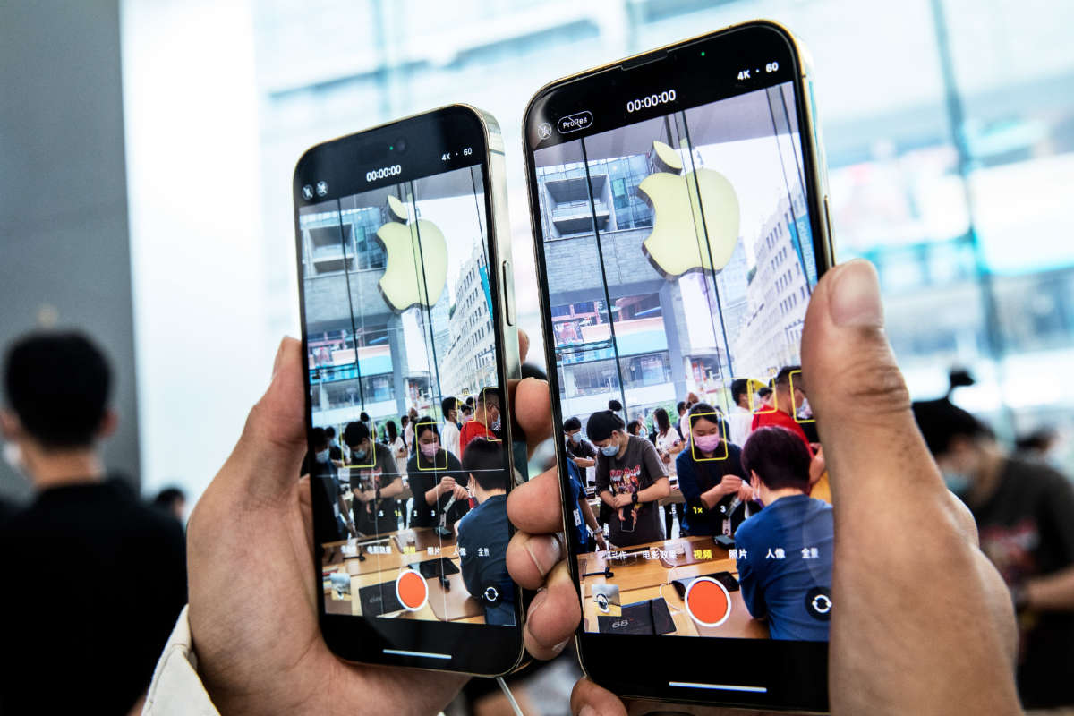 Customers try out new iPhones at an Apple store as iPhone 14 series go on sale on September 16, 2022, in Shanghai, China.