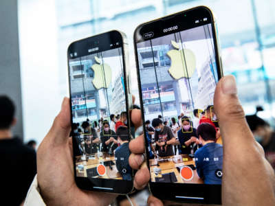 Customers try out new iPhones at an Apple store as iPhone 14 series go on sale on September 16, 2022, in Shanghai, China.