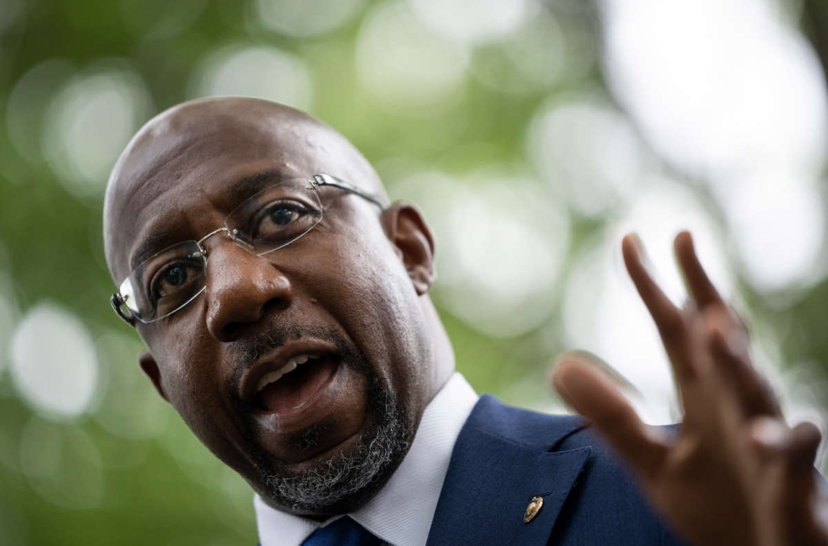 Sen. Raphael Warnock speaks during a rally about voting rights and ending the filibuster near the U.S. Capitol on August 3, 2021, in Washington, D.C.