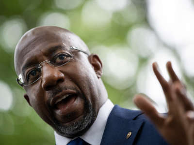 Sen. Raphael Warnock speaks during a rally about voting rights and ending the filibuster near the U.S. Capitol on August 3, 2021, in Washington, D.C.