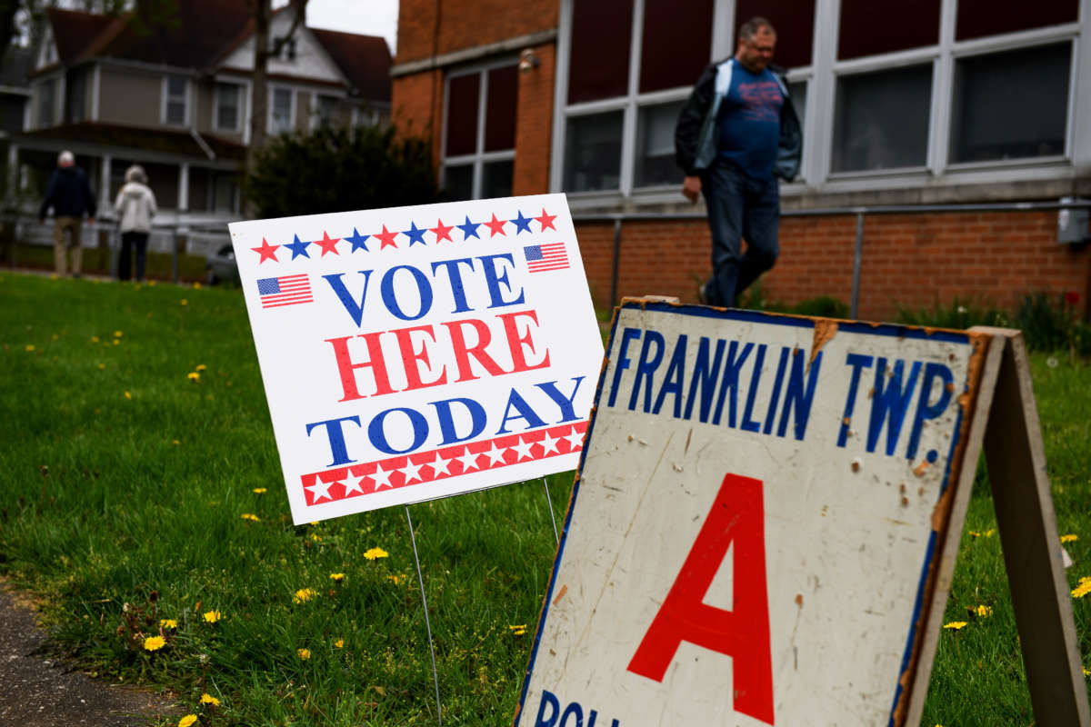 Voters leave after casting their ballots during primary voting at Central Elementary School on May 3, 2022, in Kent, Ohio.