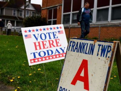 Voters leave after casting their ballots during primary voting at Central Elementary School on May 3, 2022, in Kent, Ohio.