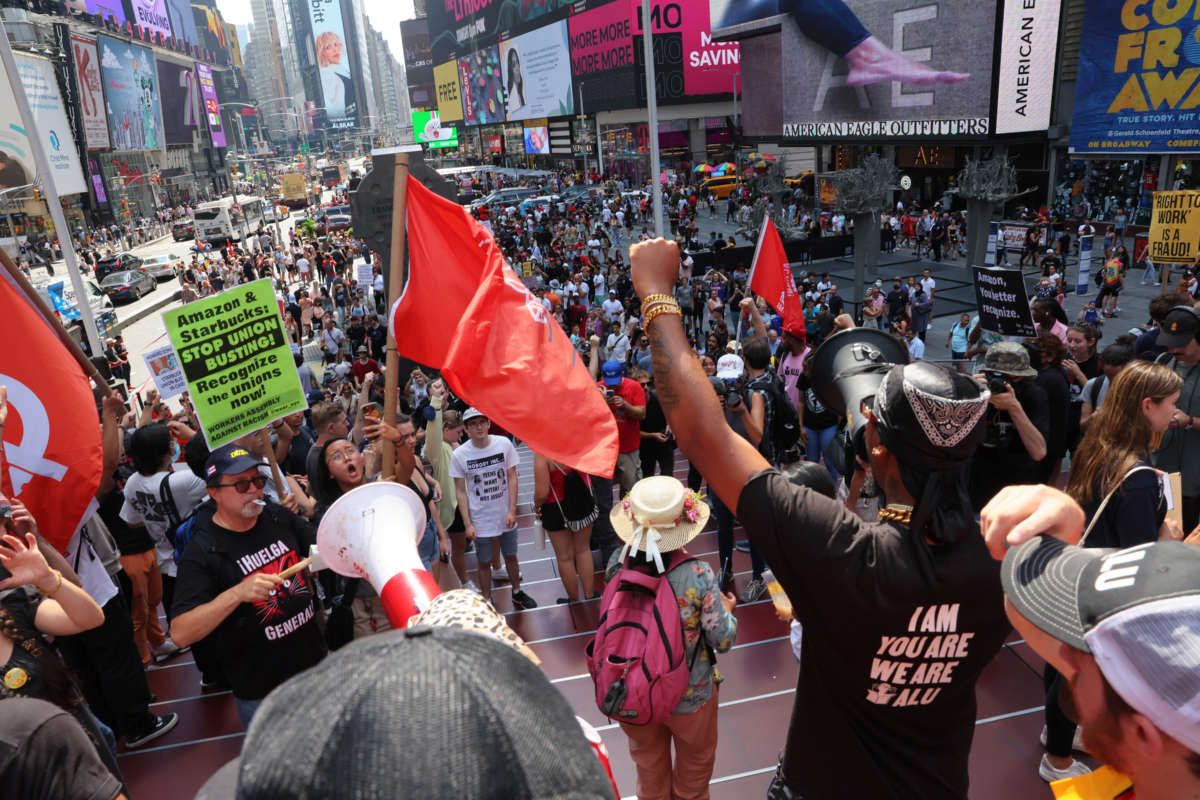 Christian Smalls, President of the ALU, leads pro-union protestors in a chant they hold a rally at Times Square on September 5, 2022, in New York City.