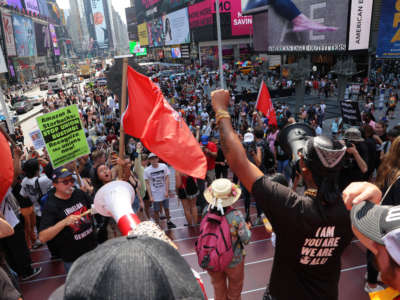 Christian Smalls, President of the ALU, leads pro-union protestors in a chant they hold a rally at Times Square on September 5, 2022, in New York City.