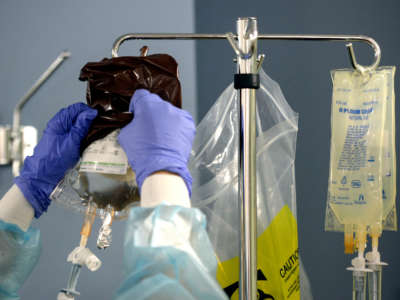 A nurse hangs medicine as a patient goes through his fifth and final round of chemotherapy at MedStar Georgetown University Hospital on October 17, 2013.