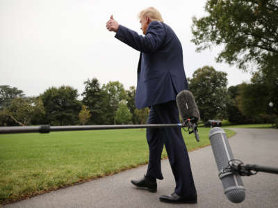 Then-President Donald Trump gestures after talking to journalists before departing the White House on September 24, 2020, in Washington, D.C.