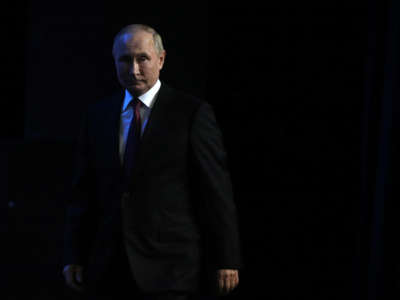 Russian President Vladimir Putin enters the hall during a concert at the Grand Kremlin Palace, September 20, 2022, in Moscow, Russia.