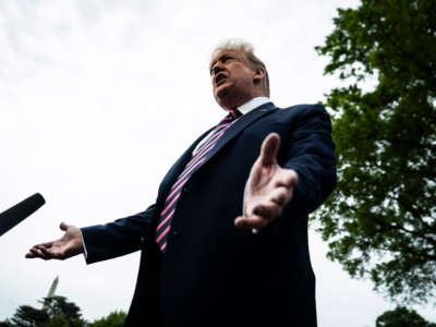 Then-President Donald Trump stops to talk to reporters on the South Lawn at the White House on May 5, 2020, in Washington, D.C.