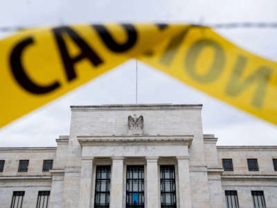The U.S. Federal Reserve building is seen past caution tape in Washington, D.C., on September 19, 2022.