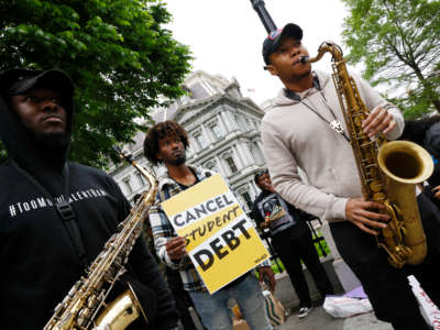 Student loan borrowers gather near The White House to tell President Biden to cancel student debt on May 12, 2020 in Washington, D.C.