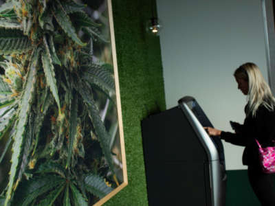 A customer uses an ATM at a medical marijuana dispensary on April 21, 2022, in Bloomfield, New Jersey.