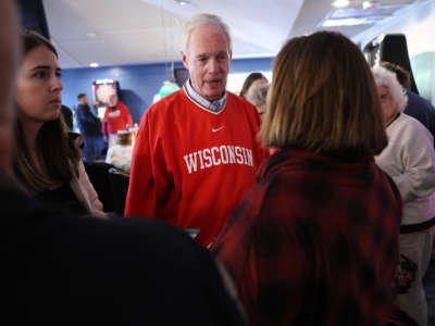 Sen. Ron Johnson greets guests during a campaign stop at the Moose Lodge Octoberfest celebration on October 8, 2022, in Muskego, Wisconsin.