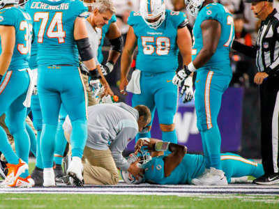 Miami Dolphins quarterback Tua Tagovailoa is attended to by medical staff after being sacked during the second quarter of an NFL football game at Paycor Stadium on September 29, 2022, in Cincinnati, Ohio.