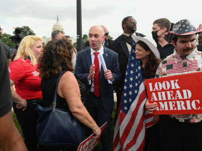Matt Braynard, center, the rally organizer and executive director of Look Ahead America, speaks to a supporter as demonstrators gather for the "Justice for J6" rally in Washington, D.C., on September 18, 2021, in support of the pro-Trump rioters who ransacked the U.S. Capitol on January 6, 2021.