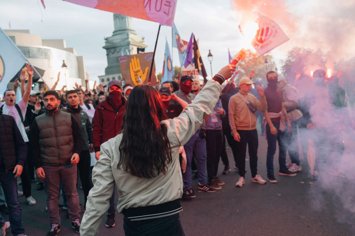 Members of the anti-fascist group Jeune Garde are seen during a rally against soaring living costs and climate inaction on October 16, 2022 in Paris.