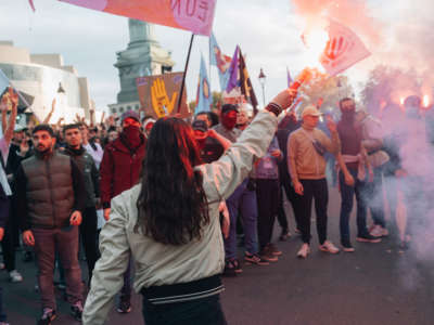 Members of the anti-fascist group Jeune Garde are seen during a rally against soaring living costs and climate inaction on October 16, 2022 in Paris.