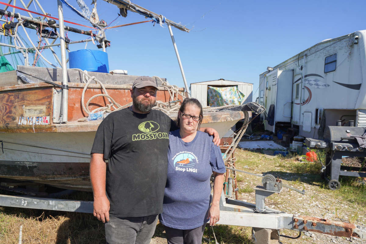 37-year-old fisherman Travis Dardar, left, and 43-year-old Nicole Dardar pose in front of their trailer in Cameron, Louisiana, on September 29, 2022. An expansion of liquified natural gas or LNG terminals as the war in Ukraine upends global fuel markets is putting Dardar’s way of life in jeopardy.