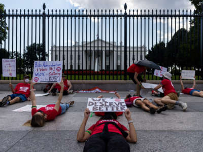 Protestors lay down outside the White House to call attention to those suffering from Myalgic Encephalomyelitis on September 19, 2022, in Washington, D.C.